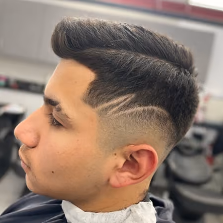 Side-Swept Quiff Fade & Dual Razor Slash Lines - High-volume side-swept quiff top with clean mid fade accented by parallel dual razor slash lines.